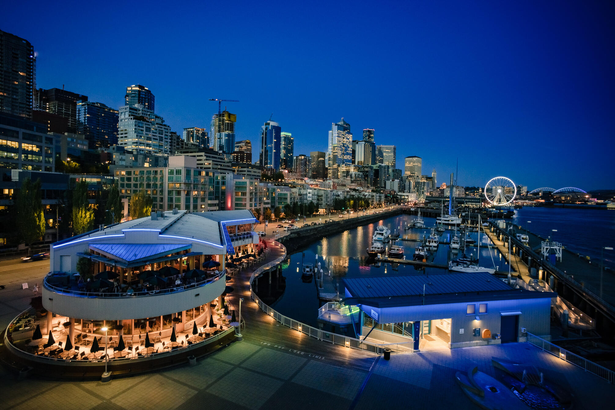 A scenic overlook in Seattle Washington over waterside restaurant and entertainment district.